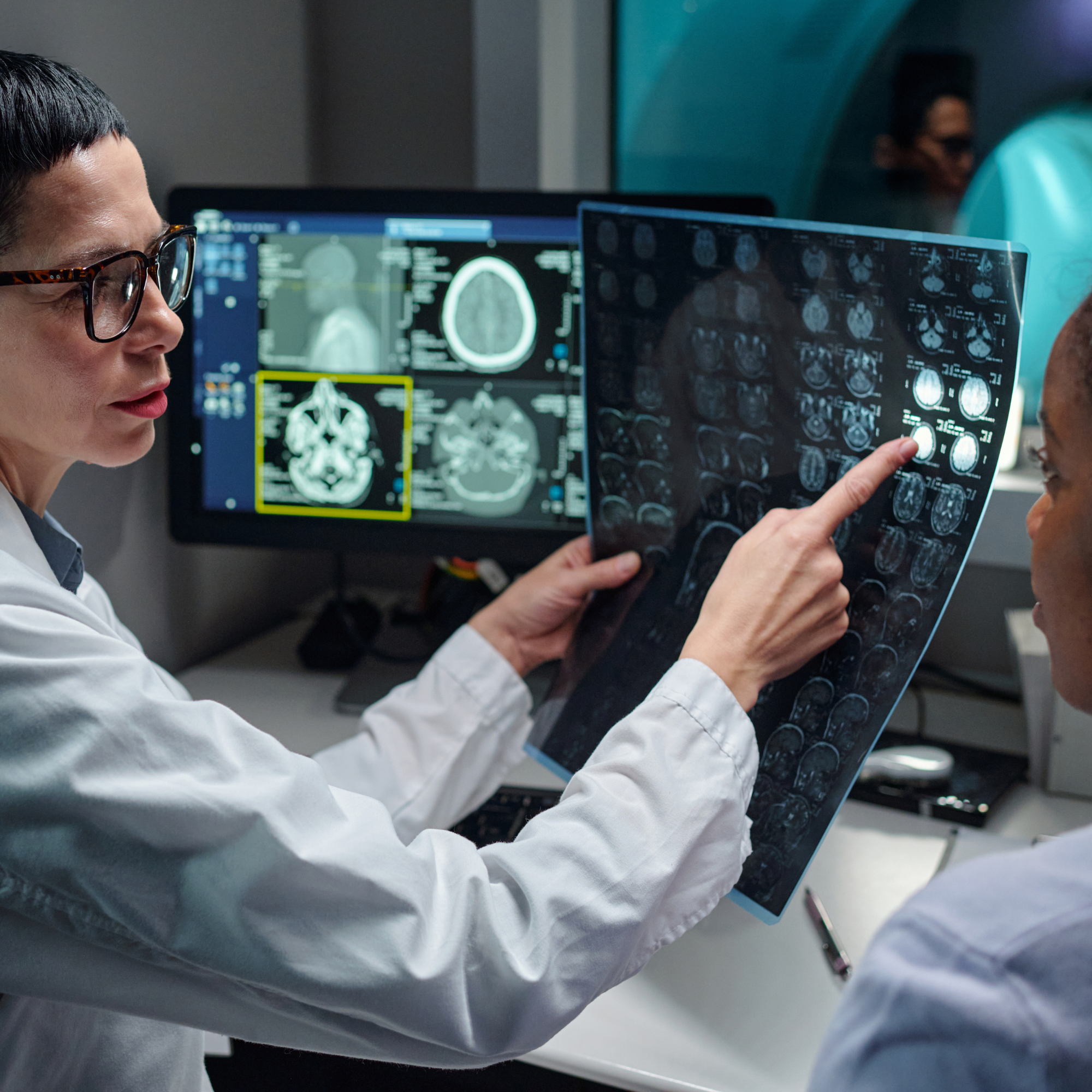 Medical radiation technologist supporting a patient during diagnostic imaging